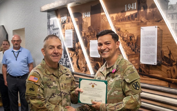 Captain Eric Inman receives a Meritorious Service Medal