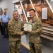 Captain Eric Inman receives a Meritorious Service Medal