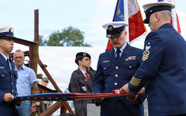 U.S. Coast Guard perform folding of the flag ceremony