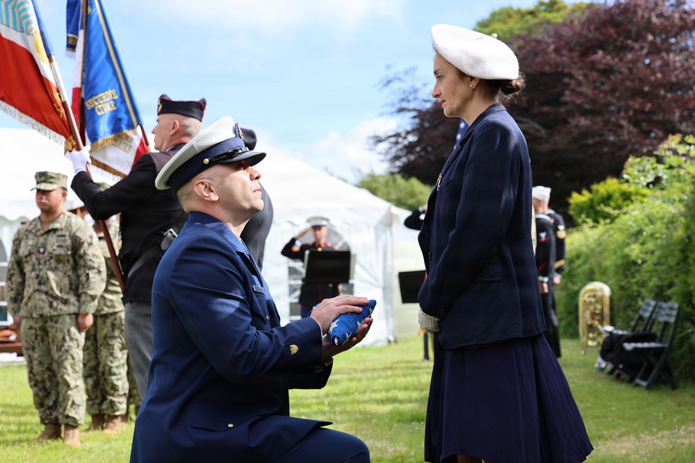U.S. Coast Guard Senior Chief presenting the flag