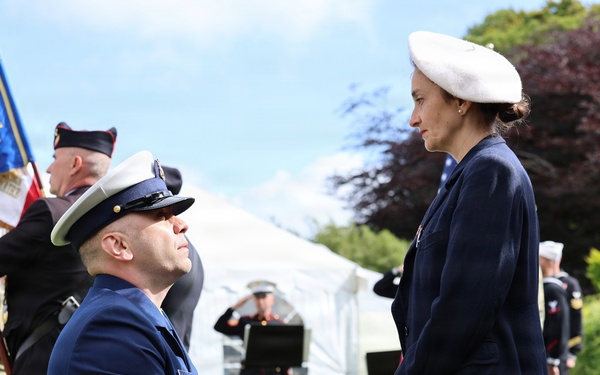 U.S. Coast Guard Senior Chief presenting the flag