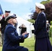 U.S. Coast Guard Senior Chief presenting the flag