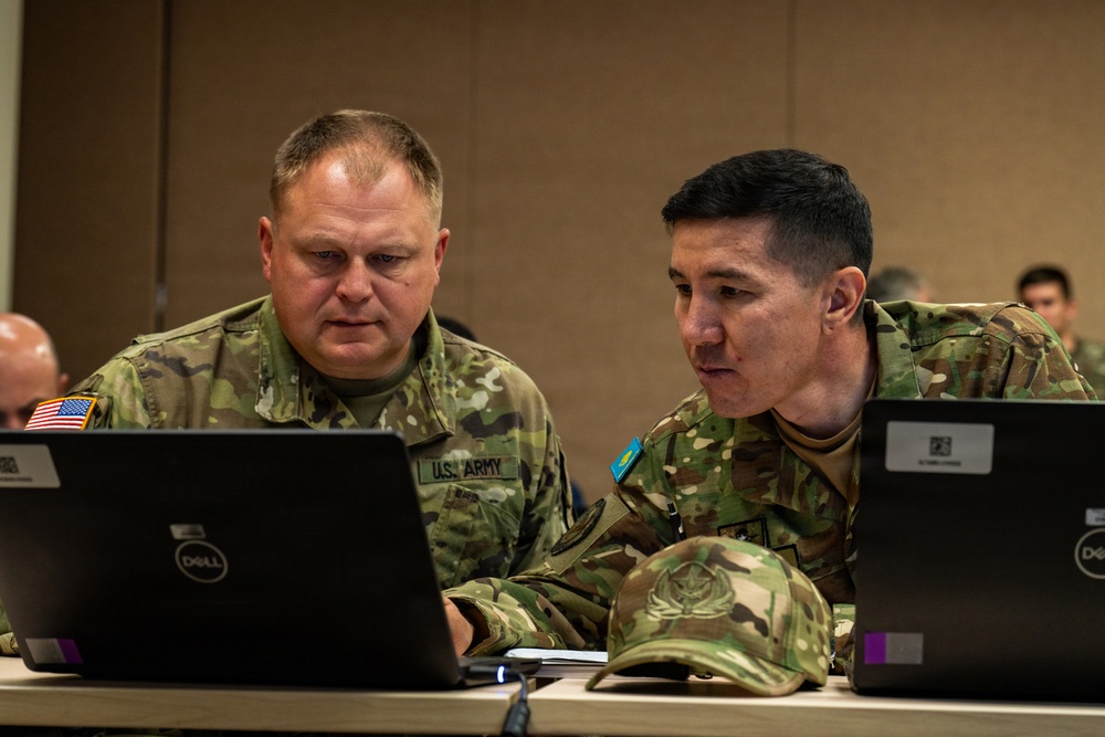 U.S. Army Soldier and Kazakhstan Partner Collaborate During Command Post Exercise of RC26