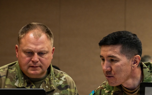 U.S. Army Soldier and Kazakhstan Partner Collaborate During Command Post Exercise of RC26