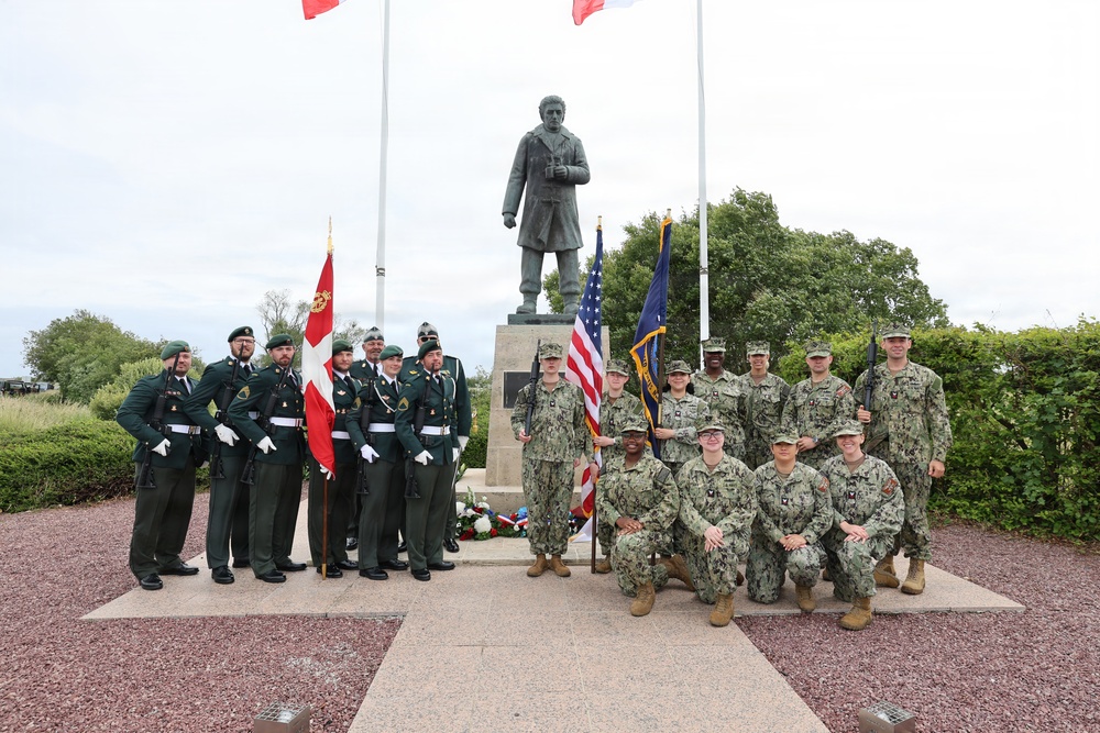 U.S. Navy Sailors and National Guard of Denmark stand together at the Danish Sailor Memorial