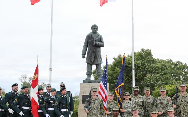 U.S. Navy Sailors and National Guard of Denmark stand together at the Danish Sailor Memorial
