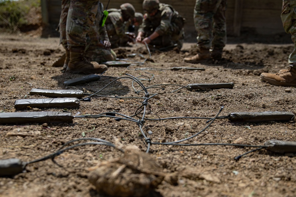 Engineers detonate confidence, shape and crater charges.