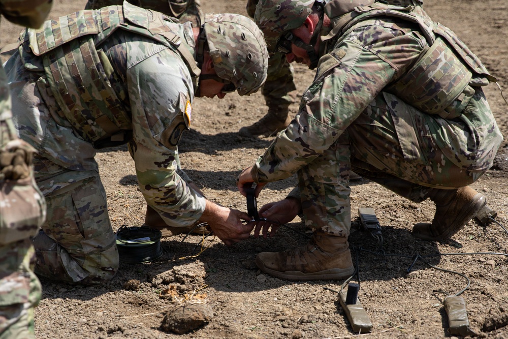 Engineers detonate confidence, shape and crater charges.