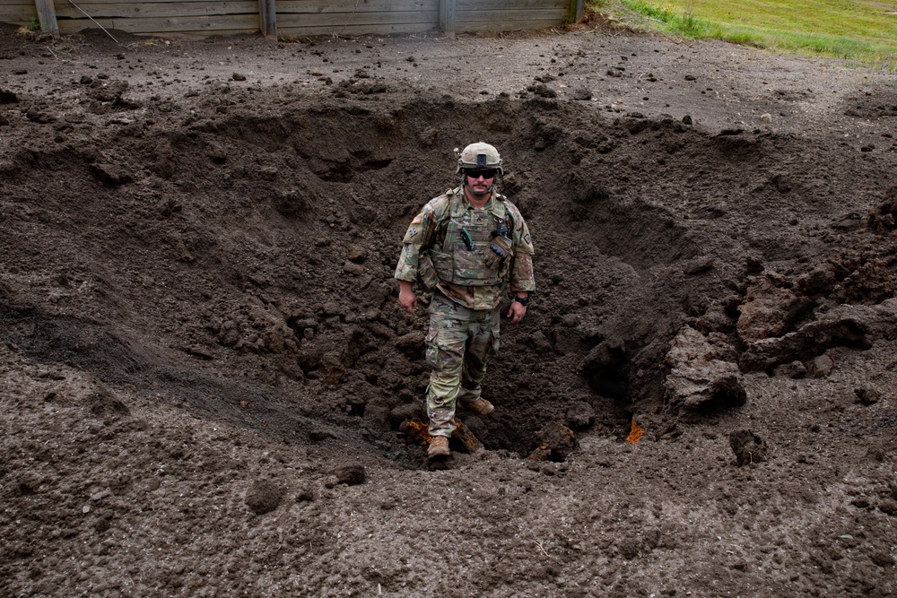 Engineers detonate confidence, shape and crater charges.