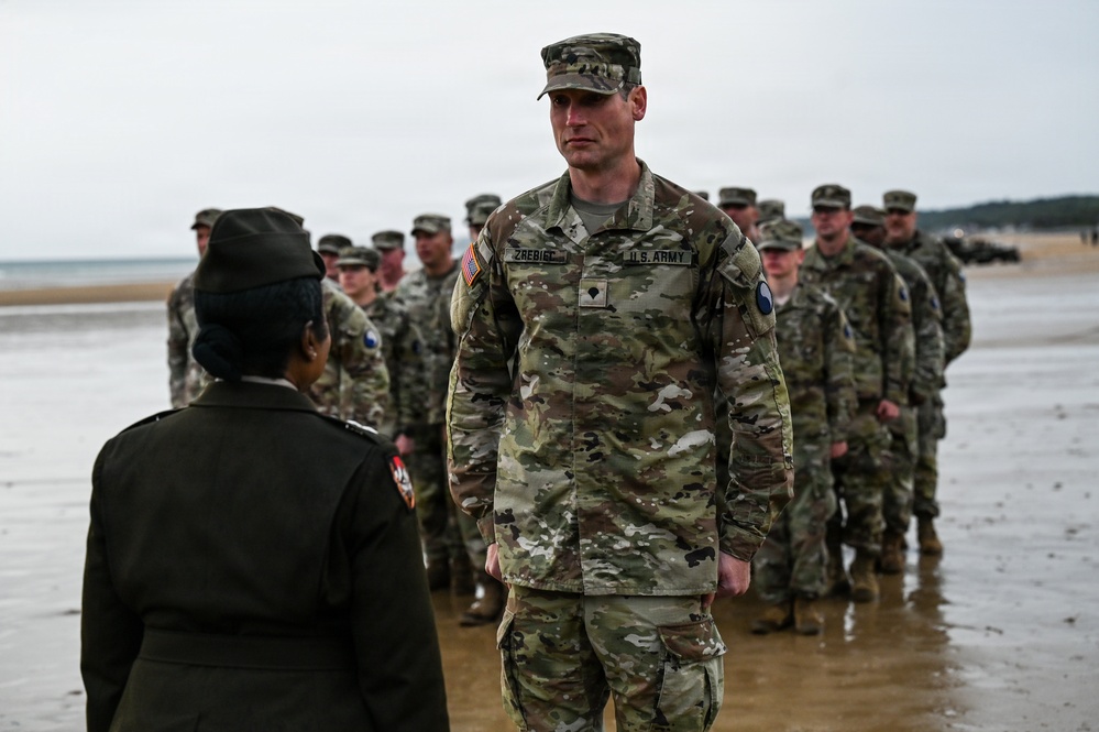 Birckhead promotes top Soldier to SGT in Omaha Beach ceremony