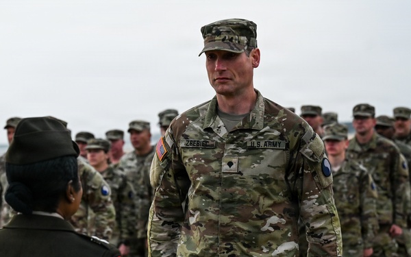 Birckhead promotes top Soldier to SGT in Omaha Beach ceremony