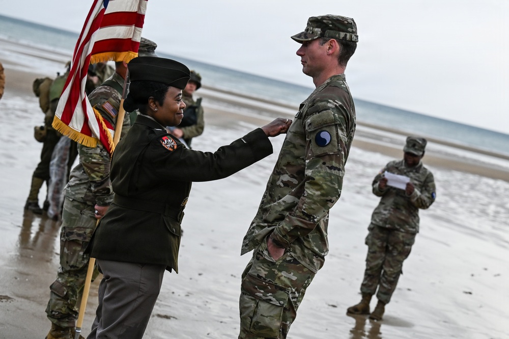 Birckhead promotes top Soldier to SGT in Omaha Beach ceremony