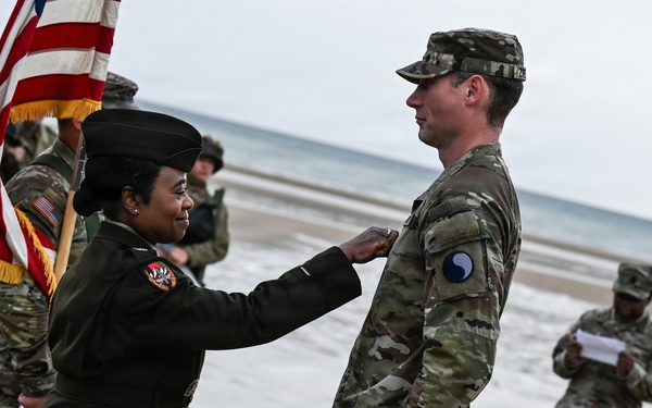Birckhead promotes top Soldier to SGT in Omaha Beach ceremony