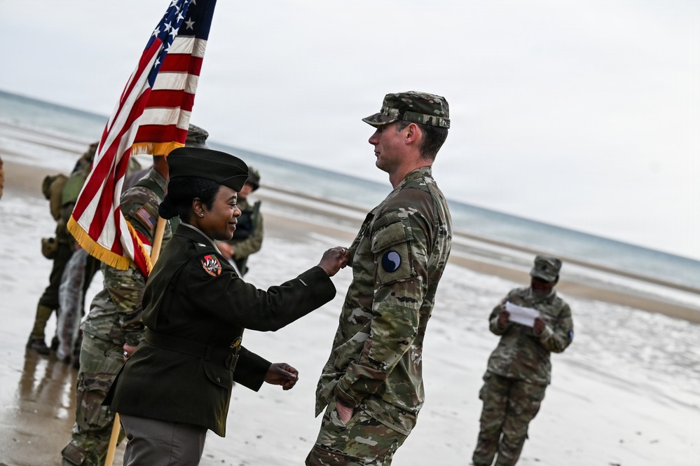 Birckhead promotes top Soldier to SGT in Omaha Beach ceremony