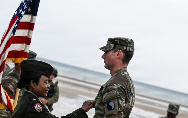 Birckhead promotes top Soldier to SGT in Omaha Beach ceremony
