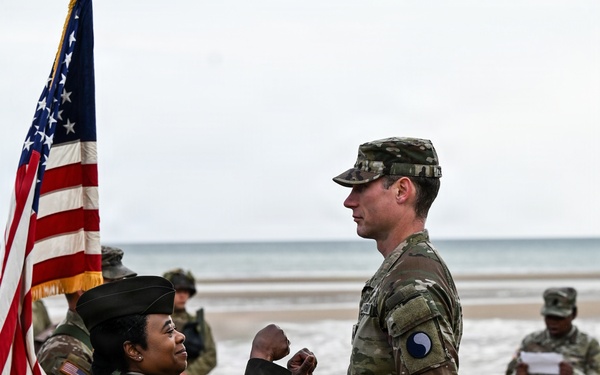 Birckhead promotes top Soldier to SGT in Omaha Beach ceremony