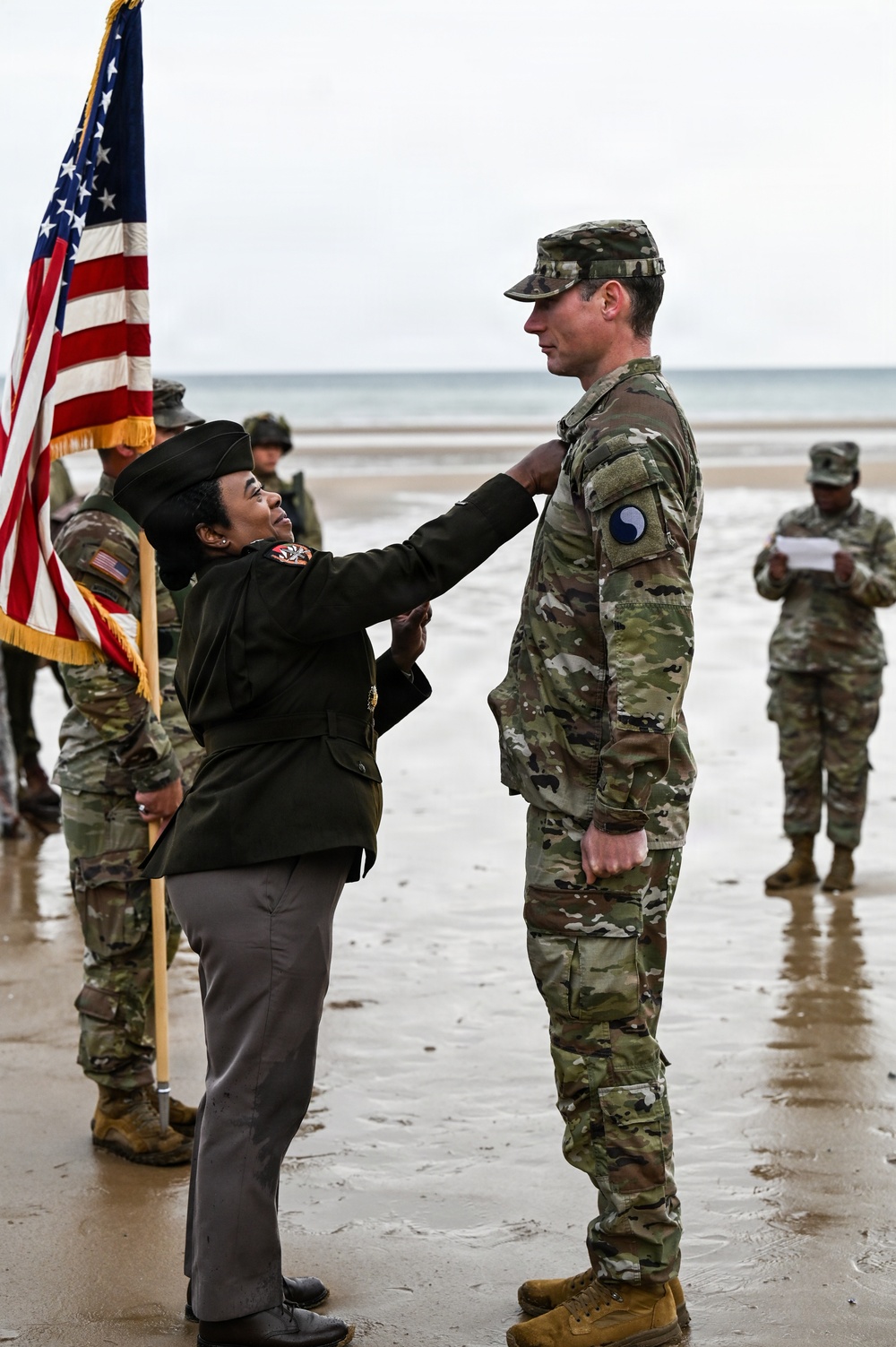 Birckhead promotes top Soldier to SGT in Omaha Beach ceremony