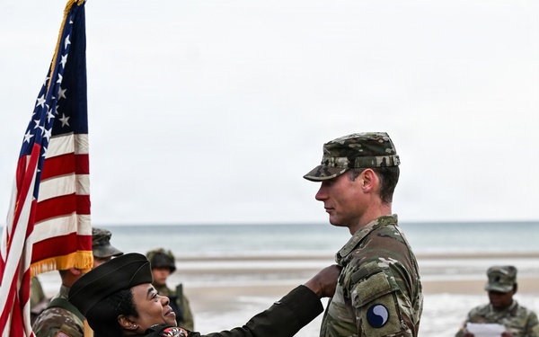 Birckhead promotes top Soldier to SGT in Omaha Beach ceremony