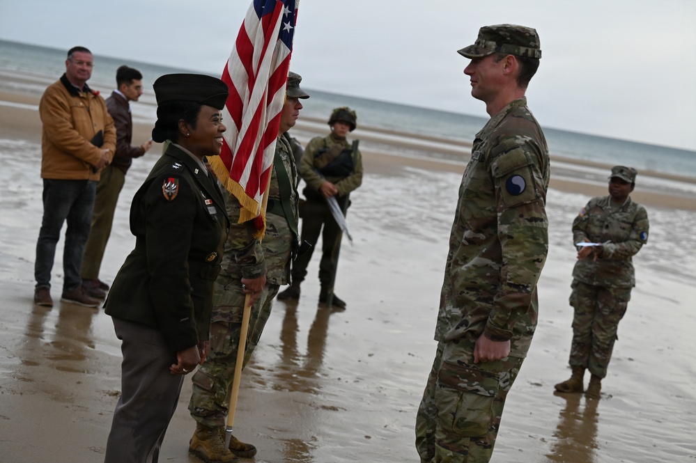 Birckhead promotes top Soldier to SGT in Omaha Beach ceremony