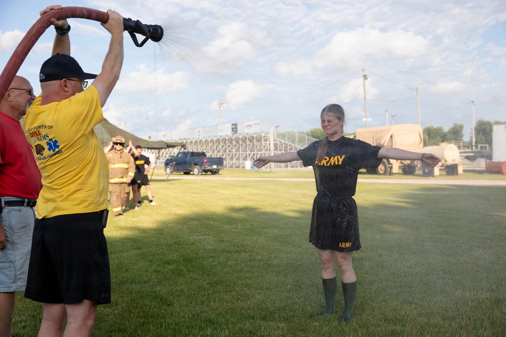 Spc. Bushman Hosed with Water during CBRN Training