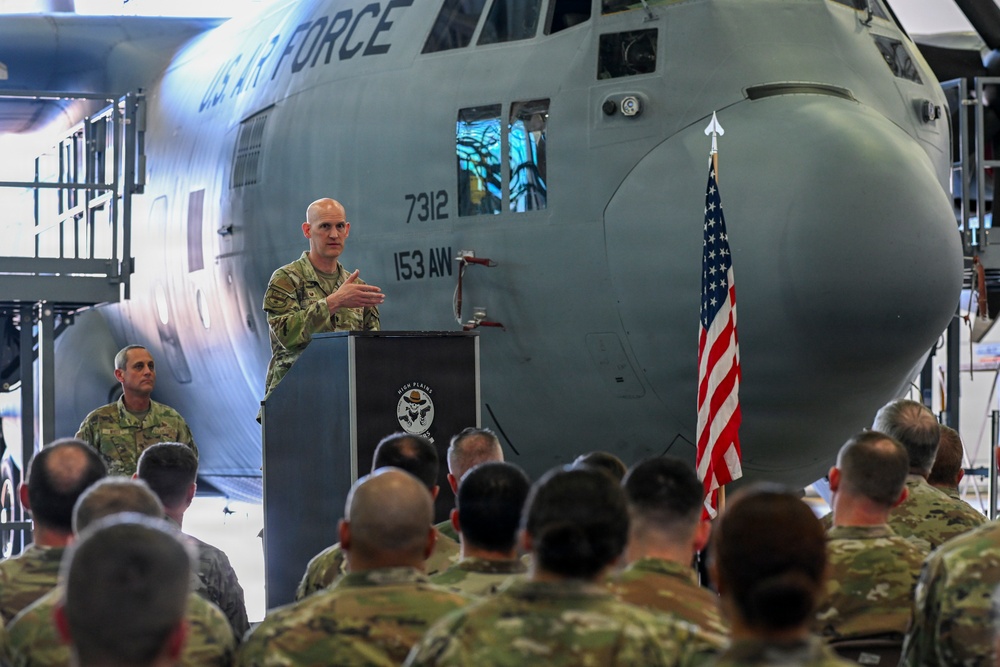 Lt. Col. John Jasper addresses airmen during ceremony at 153rd Airlift Wing hangar
