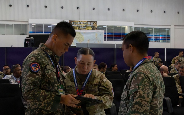 U.S. service members deliver briefs during Bersama Warrior 2026