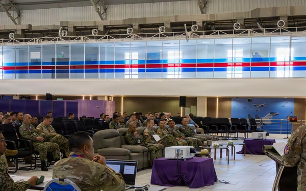 U.S. service members deliver briefs during Bersama Warrior 2026