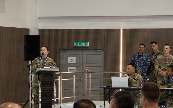 U.S. service members deliver briefs during Bersama Warrior 2026