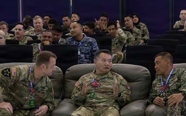 U.S. service members deliver briefs during Bersama Warrior 2026
