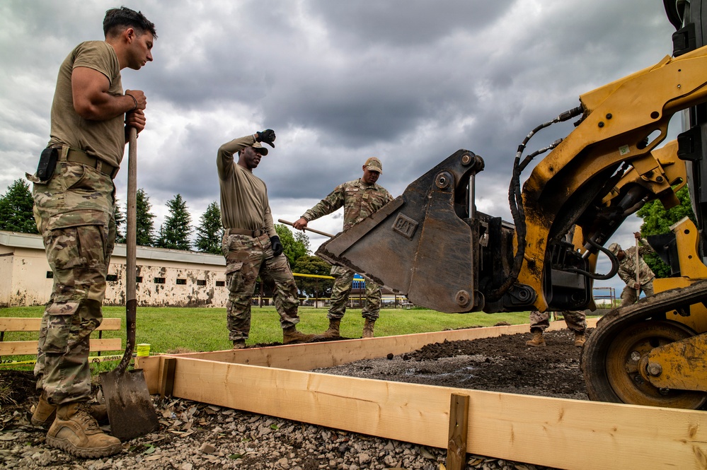 Civil engineers prepare concrete pad
