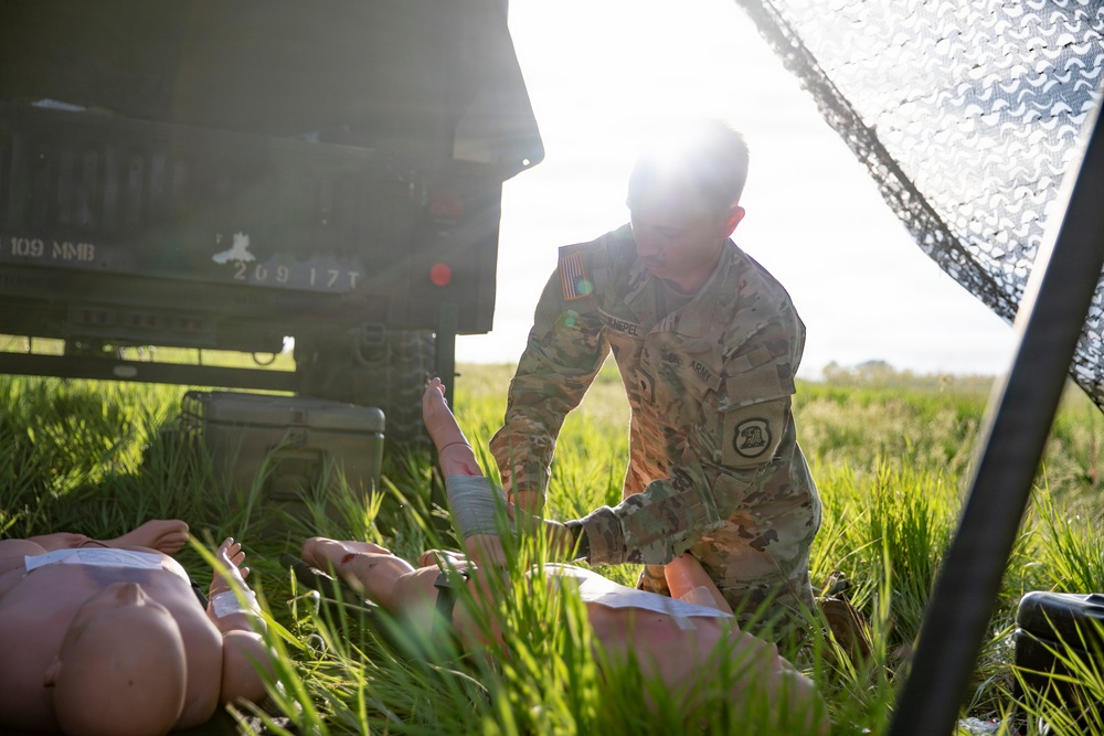 Spc. Knepel Providing Aid - Hawkeye River Run