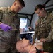 Sgt. Vesely and Spc. Weis Treat Patient - Hawkeye River Run
