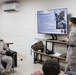 U.S. Marines and Sailors Attend a COMMSTRAT MOS Overview Class