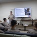 U.S. Marines and Sailors Attend a COMMSTRAT MOS Overview Class