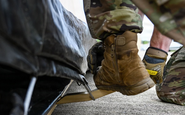 346th EABS Airmen build tents