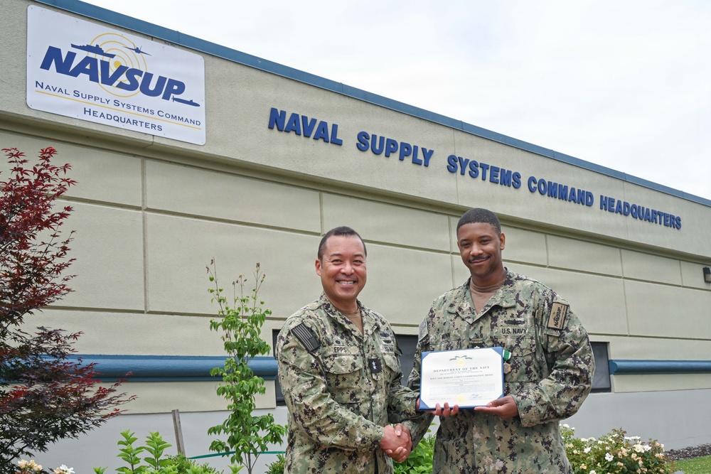 Lt. Cmdr. Christopher Munn receives fourth Meritorious Service Award