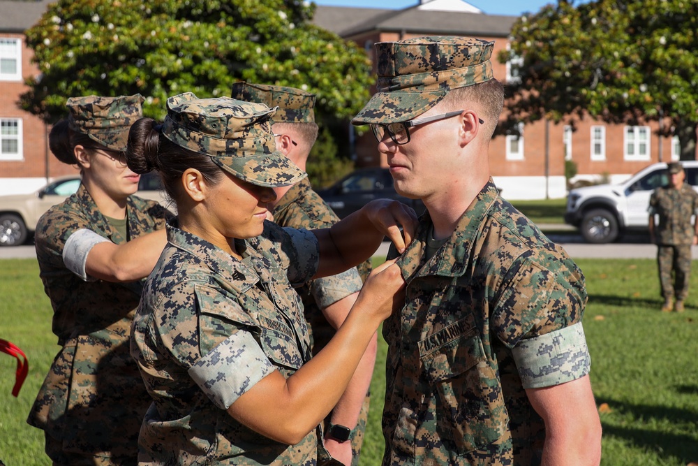 Never too far apart: Identical twins get promoted to the rank of Corporal
