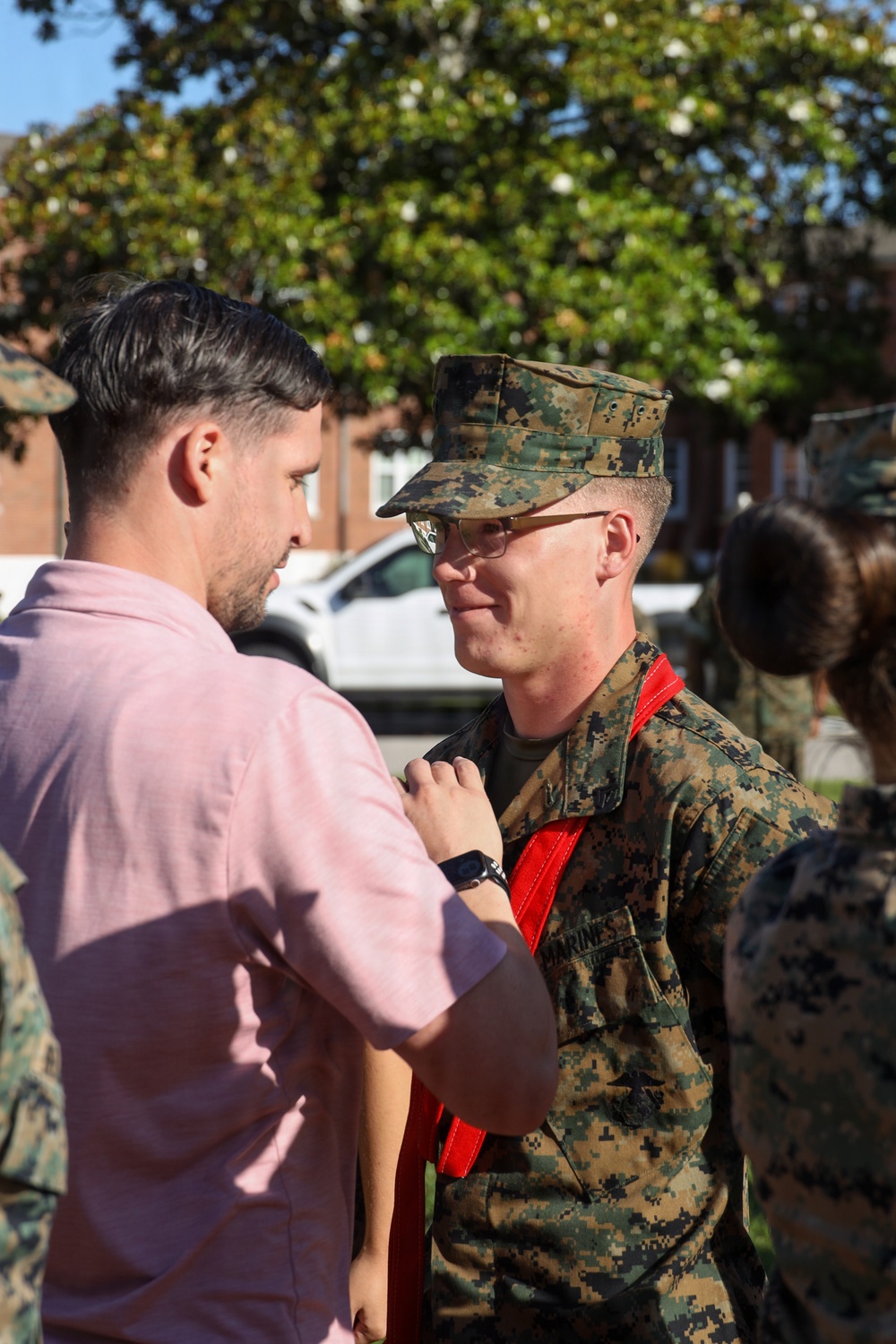 Never too far apart: Identical twins get promoted to the rank of Corporal