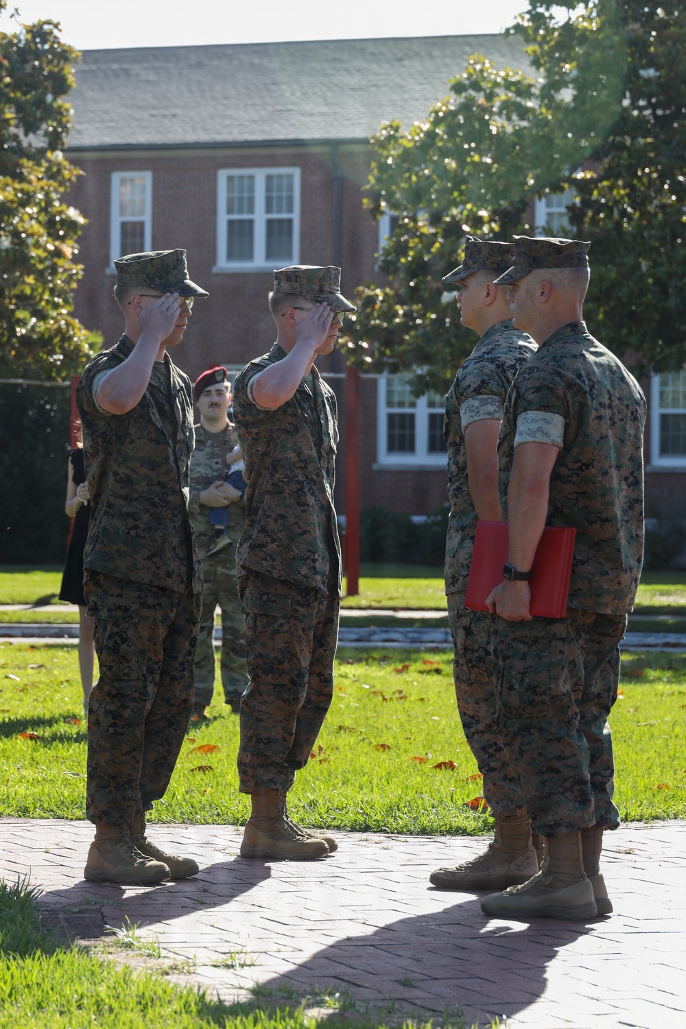 Never too far apart: Identical twins get promoted to the rank of Corporal
