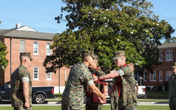 Never too far apart: Identical twins get promoted to the rank of Corporal