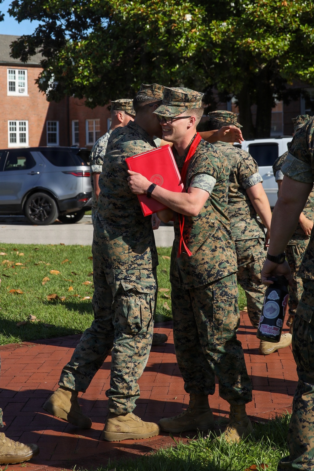 Never too far apart: Identical twins get promoted to the rank of Corporal