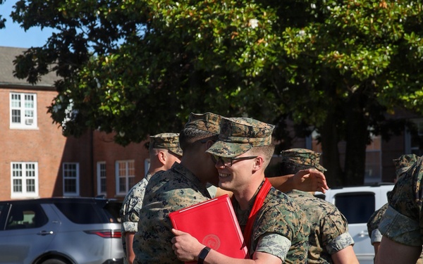 Never too far apart: Identical twins get promoted to the rank of Corporal