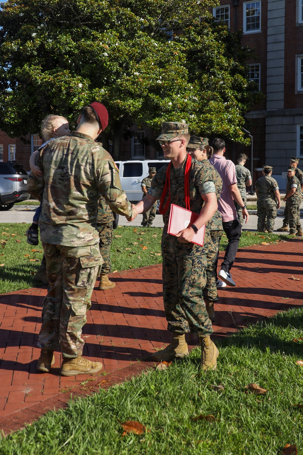 Never too far apart: Identical twins get promoted to the rank of Corporal