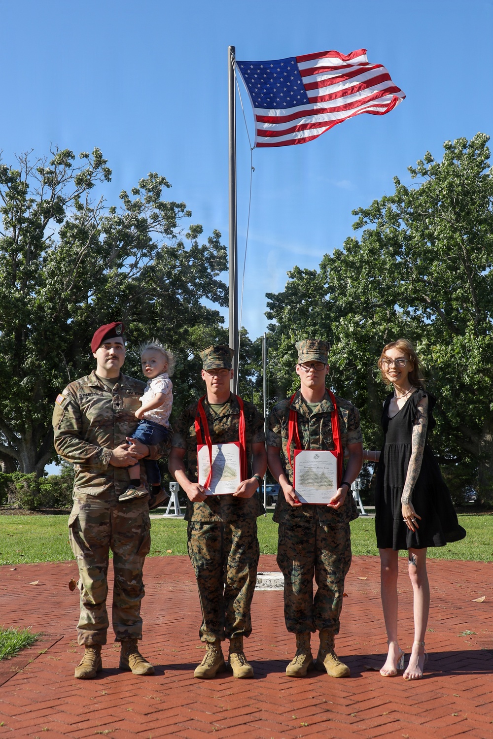 Never too far apart: Identical twins get promoted to the rank of Corporal