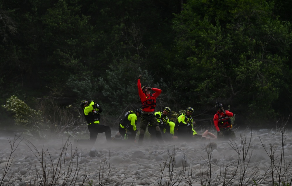 U.S. Coast Guard Air Station Astoria crew works alongside Oregon National Guard, Clackamas County Fire Department and other partner agencies during a full-scale inland water rescue training exercise in Sandy Oregon.