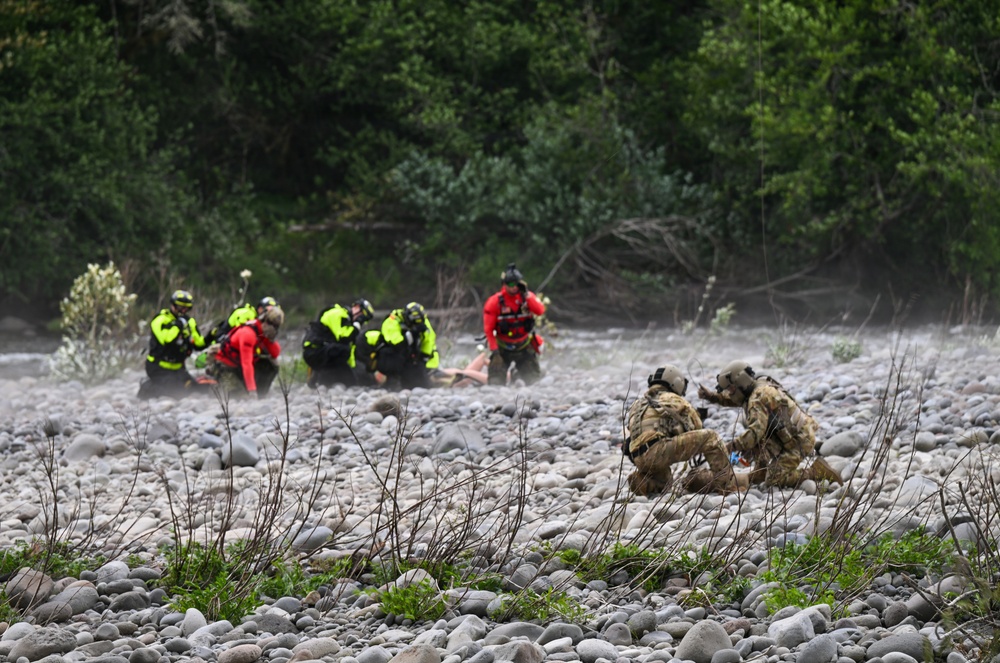 U.S. Coast Guard Air Station Astoria crew works alongside Oregon National Guard, Clackamas County Fire Department and other partner agencies during a full-scale inland water rescue training exercise in Sandy Oregon.