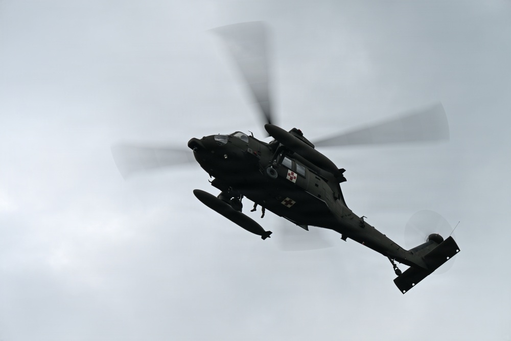 U.S. Coast Guard Air Station Astoria crew works alongside Oregon National Guard, Clackamas County Fire Department and other partner agencies during a full-scale inland water rescue training exercise in Sandy Oregon.