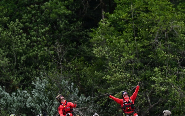 U.S. Coast Guard Air Station Astoria crew works alongside Oregon National Guard, Clackamas County Fire Department and other partner agencies during a full-scale inland water rescue training exercise in Sandy Oregon.