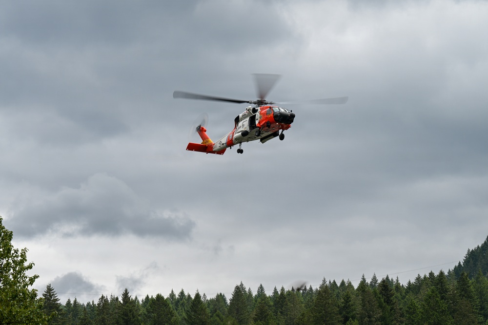 U.S. Coast Guard Air Station Astoria crew works alongside Oregon National Guard, Clackamas County Fire Department and other partner agencies during a full-scale inland water rescue training exercise in Sandy Oregon.