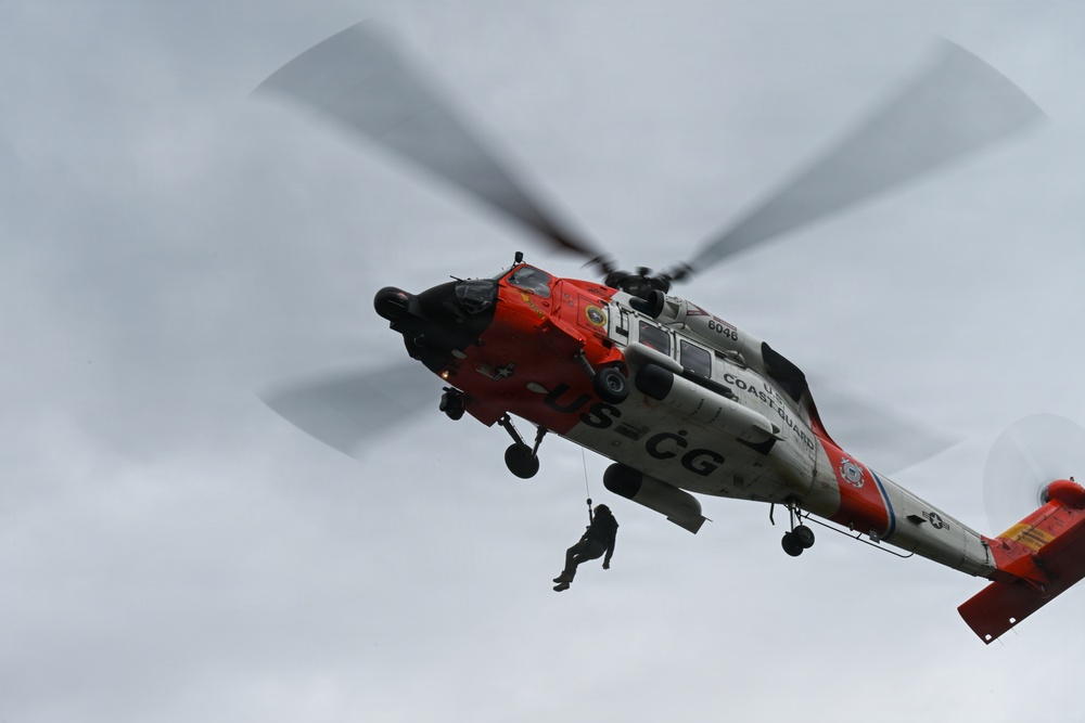U.S. Coast Guard Air Station Astoria crew works alongside Oregon National Guard, Clackamas County Fire Department and other partner agencies during a full-scale inland water rescue training exercise in Sandy Oregon.